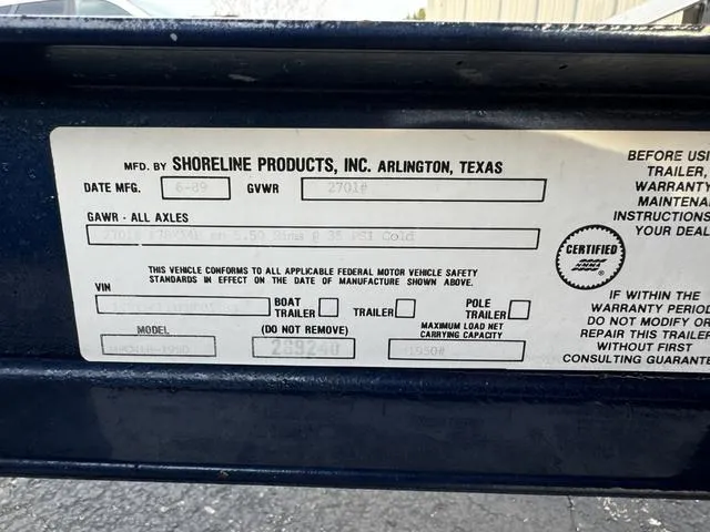 Slide: The Image of Label on Shoreline Products trailer, Arlington, Texas, with specifications and safety information. - 27