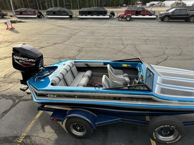 Slide: The Image of 1989 Hydrostream Vegas XT boat with Mercury outboard motor on trailer. - 8