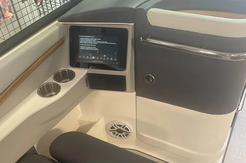 Slide: The Image of 2025 Regal LS9 boat interior with touchscreen, cup holders, and speaker. - 10