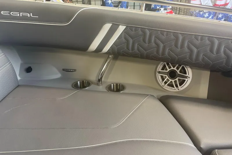 Slide: The Image of 2025 Regal LS9 boat interior with speaker, cup holders, and stylish upholstery. - 12