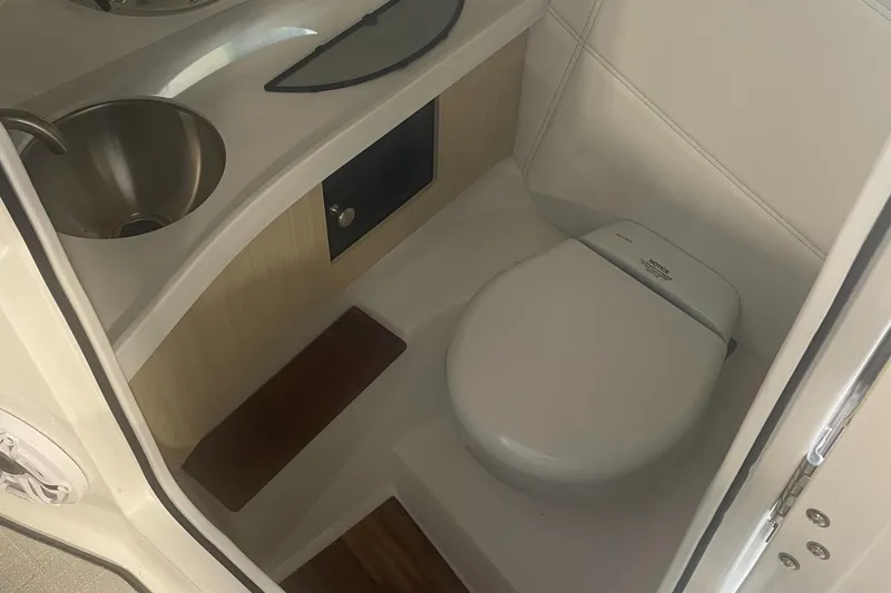 Slide: The Image of 2025 Regal LS9 boat bathroom with sink and toilet. - 14