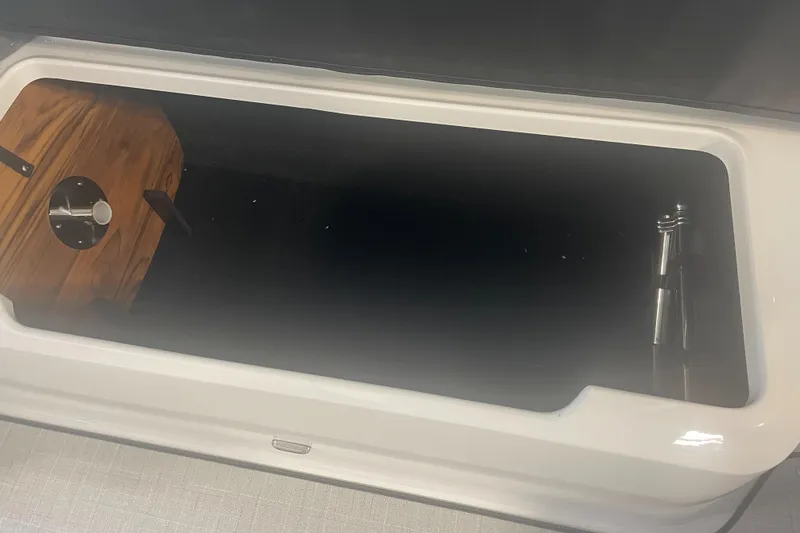 Slide: The Image of 2025 Regal LS9 storage compartment with wooden accents and sleek design. - 15