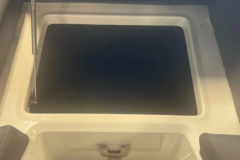 Slide: The Image of 2025 Regal LS9 storage compartment with open lid and hydraulic support. - 17