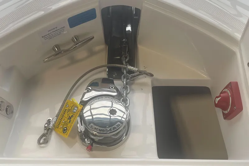 Slide: The Image of 2025 Regal LS9 boat anchor compartment with winch and chain. - 18