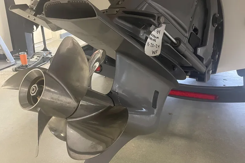 Slide: The Image of Close-up of a 2025 Regal LS9 boat propeller in a garage setting. - 20