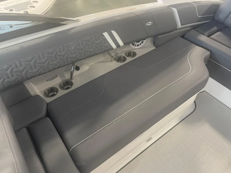 Slide: The Image of 2025 Regal LS9 boat interior with sleek gray seating and cup holders. - 6