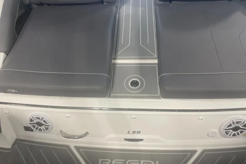 Slide: The Image of 2025 Regal LS9 boat interior with sleek gray seating and modern design. - 9