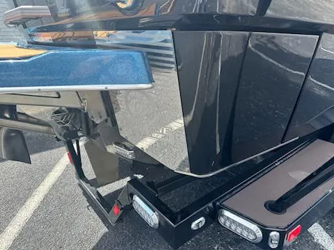 Slide: The Image of 2025 Malibu M230 interior with tan leather seats, cup holders, and storage compartments. - 6