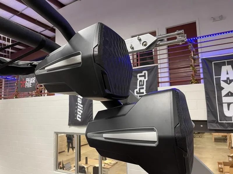 Slide: The Image of 2025 Malibu M230 boat speakers in a showroom setting. - 30