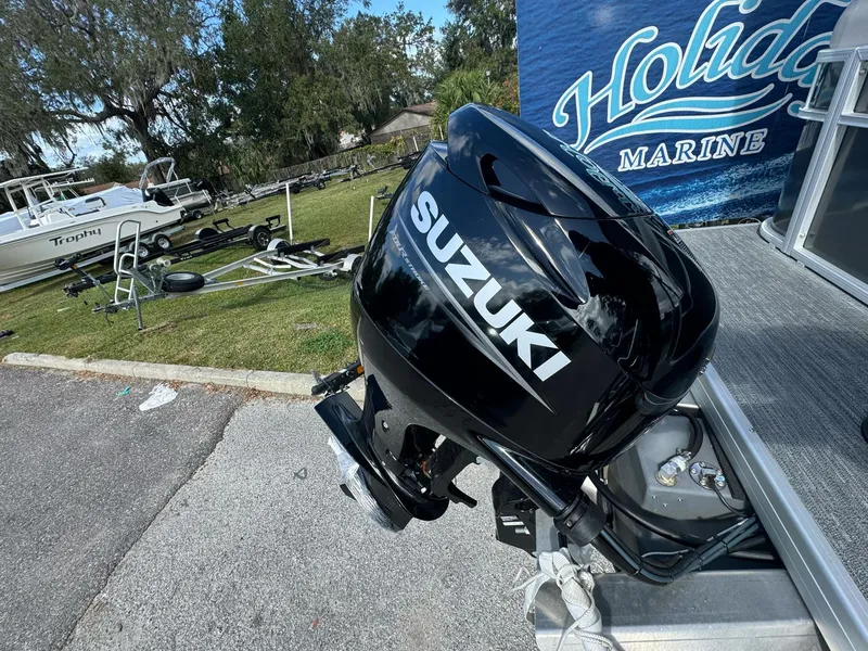 Slide: The Image of Suzuki outboard motor on Sweetwater 1886 CX boat, 2025 model, at Holiday Marine. - 10