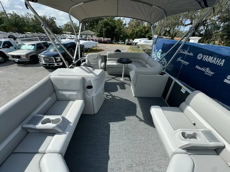 Slide: The Image of 2025 Sweetwater 1886 CX pontoon boat with spacious seating and canopy. - 7