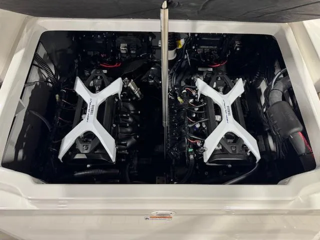 Slide: The Image of 2025 Yamaha Boats 222 FSH Sport E engine compartment with dual engines visible. - 17