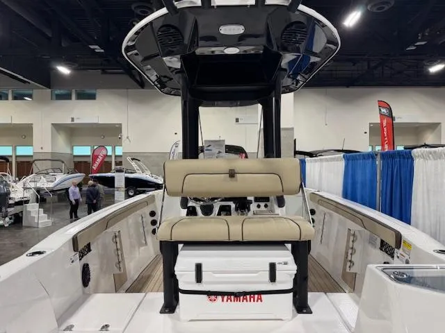 Slide: The Image of 2025 Yamaha Boats 222 FSH Sport E interior at a boat show display. - 18