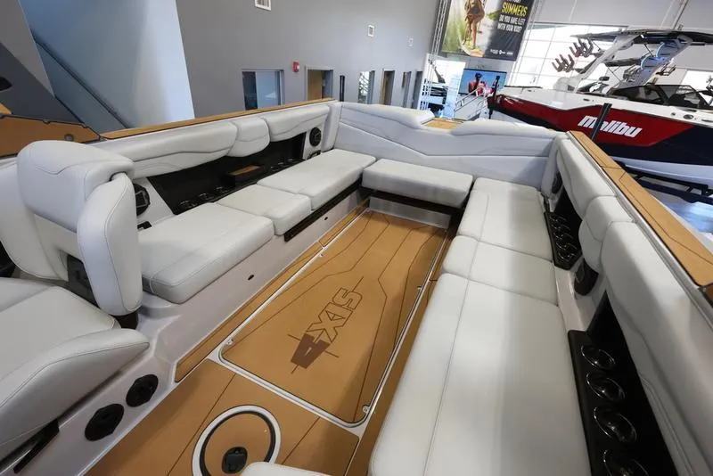 Slide: The Image of 2024 Axis T250 boat interior with spacious white seating and sleek design. - 14