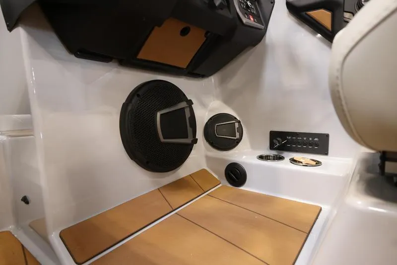 Slide: The Image of 2024 Axis T250 boat interior with speakers and control panel. - 15