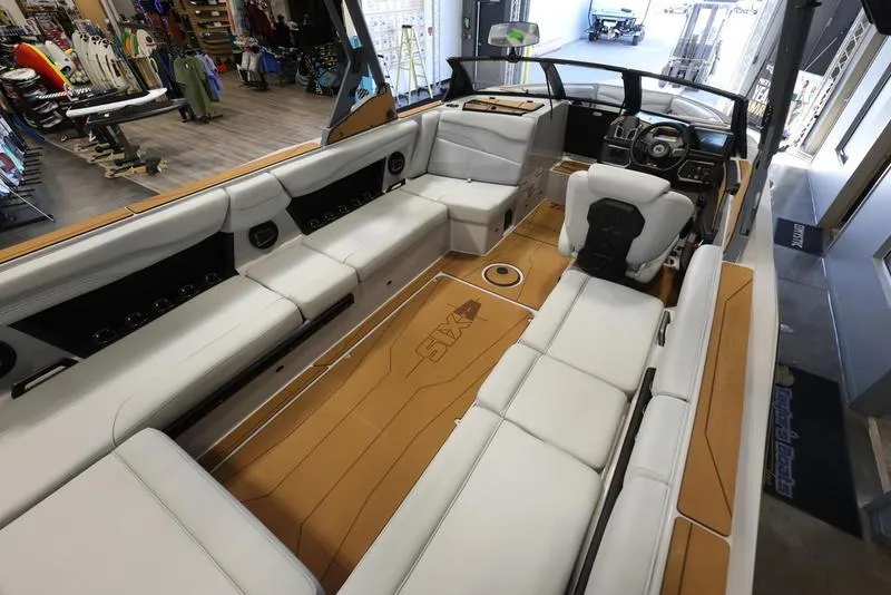 Slide: The Image of 2024 Axis T250 boat interior with spacious seating and modern dashboard. - 18