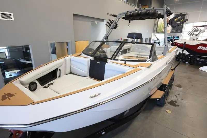 Slide: The Image of 2024 Axis T250 boat with sleek design in showroom. - 6