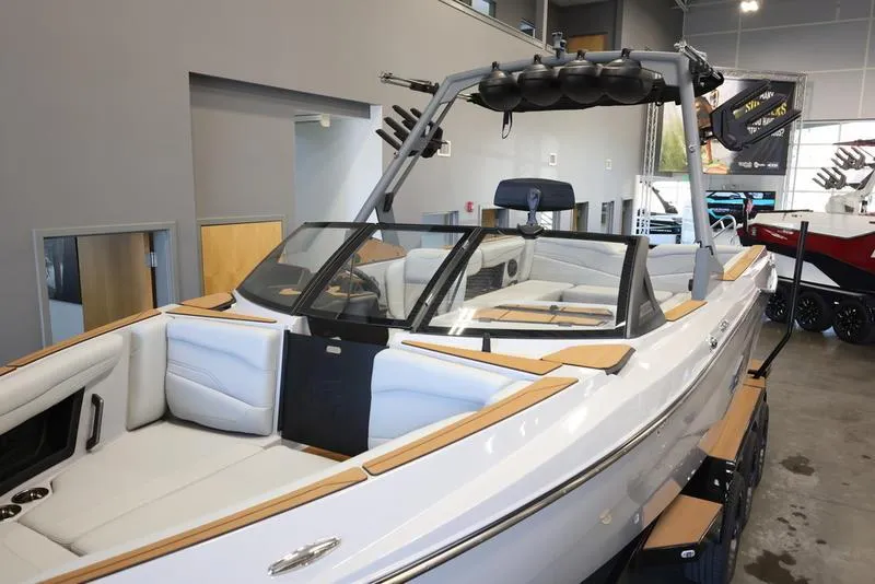 Slide: The Image of 2024 Axis T250 boat with sleek design and spacious interior in showroom. - 7