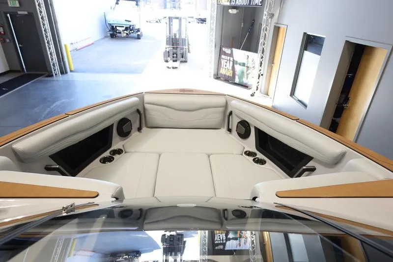 Slide: The Image of 2024 Axis T250 boat interior with white seating and modern design. - 8