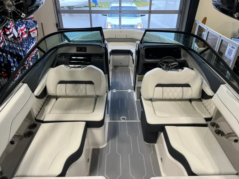 Slide: The Image of 2025 Regal LS2 Surf boat interior with luxurious white seating and modern design. - 10