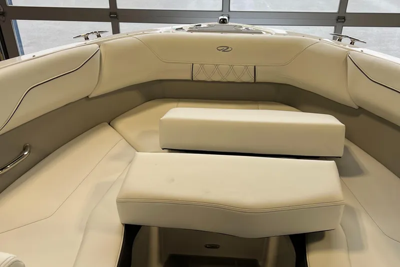 Slide: The Image of 2025 Regal LS2 Surf boat interior with luxurious white seating. - 14