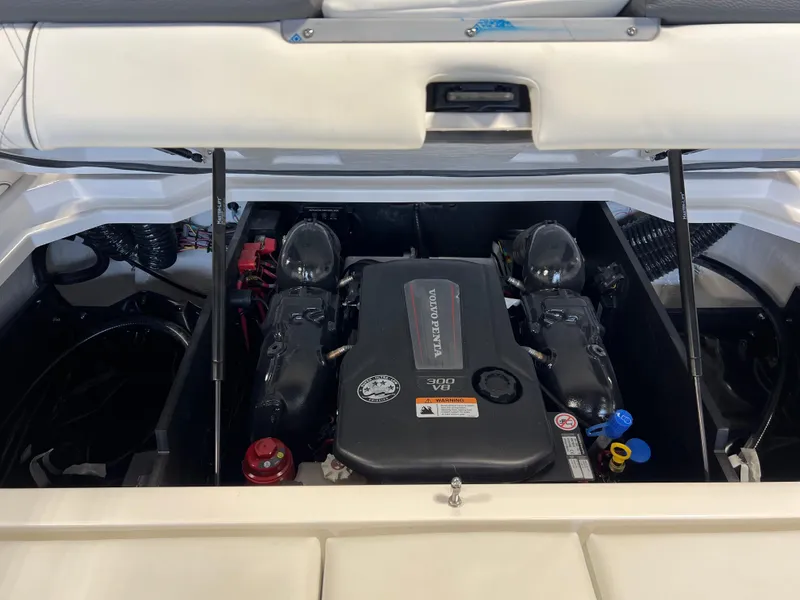 Slide: The Image of 2025 Regal LS2 Surf boat engine compartment with Volvo Penta engine. - 8
