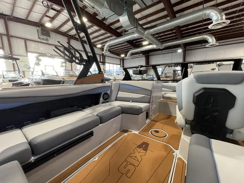 Slide: The Image of Interior of 2025 Axis A225 boat with sleek seating and modern design. - 12