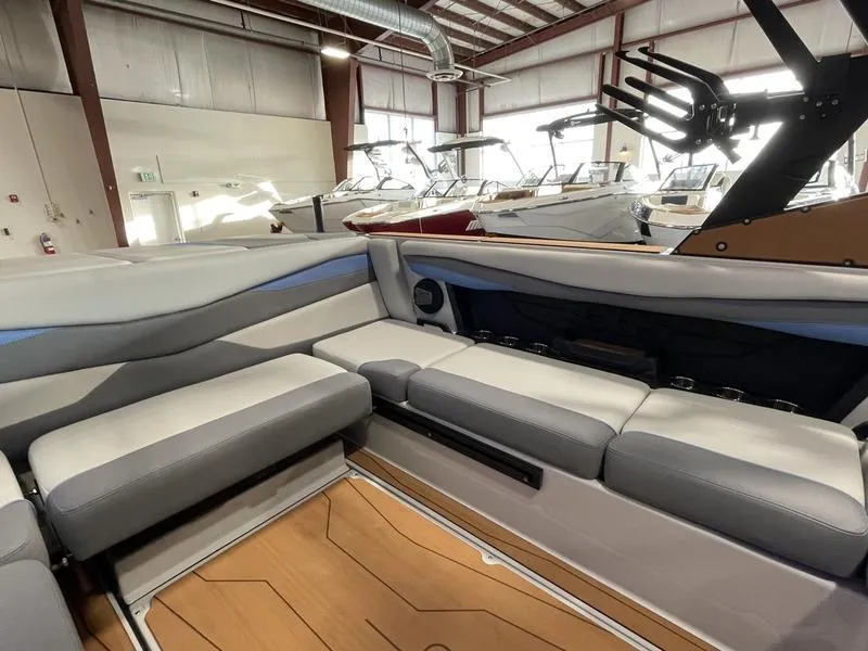 Slide: The Image of Interior of 2025 Axis A225 boat with sleek seating and modern design. - 2