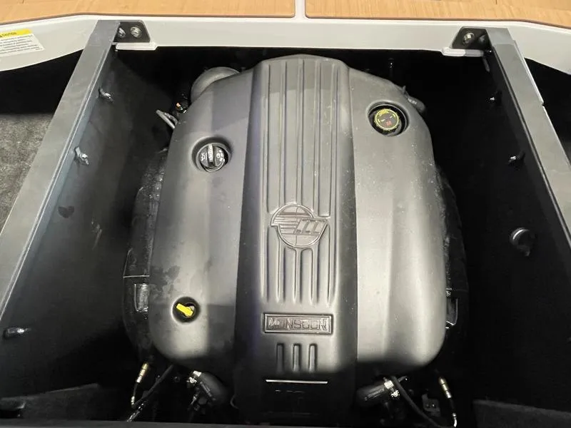 Slide: The Image of 2025 Axis A225 engine compartment with a powerful inboard motor. - 23