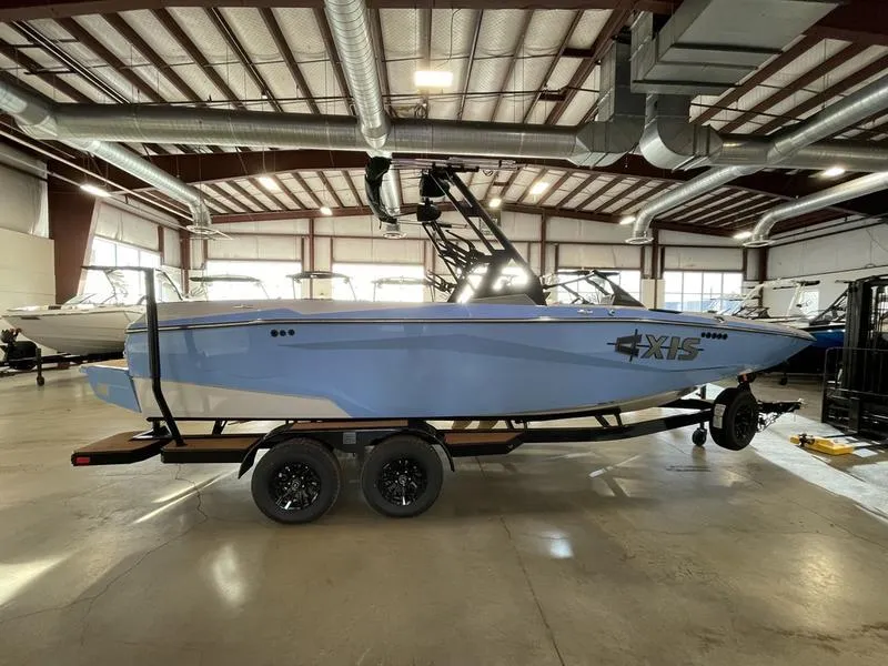 Slide: The Image of 2025 Axis A225 boat in a warehouse, showcasing sleek design and modern features. - 6