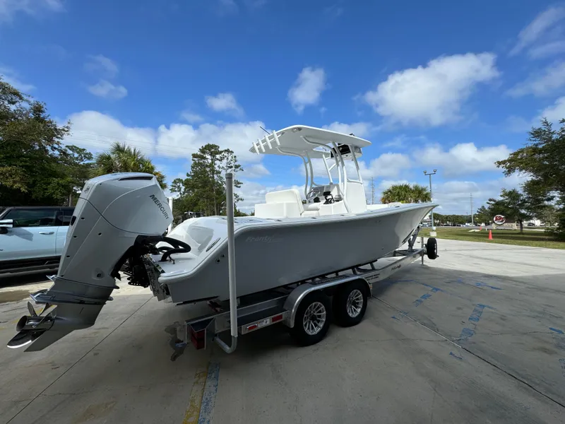 Slide: The Image of 2024 Front Runner 26 Center Console boat on trailer under blue sky. - 12
