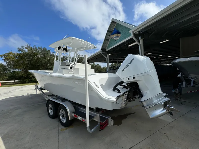 Slide: The Image of 2024 Front Runner 26 Center Console boat with Mercury engine on trailer. - 17