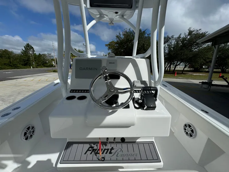 Slide: The Image of 2024 Front Runner 26 Center Console boat with Garmin navigation system. - 30