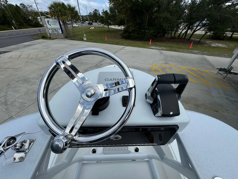 Slide: The Image of 2024 Front Runner 26 Center Console boat helm with Garmin navigation system. - 38