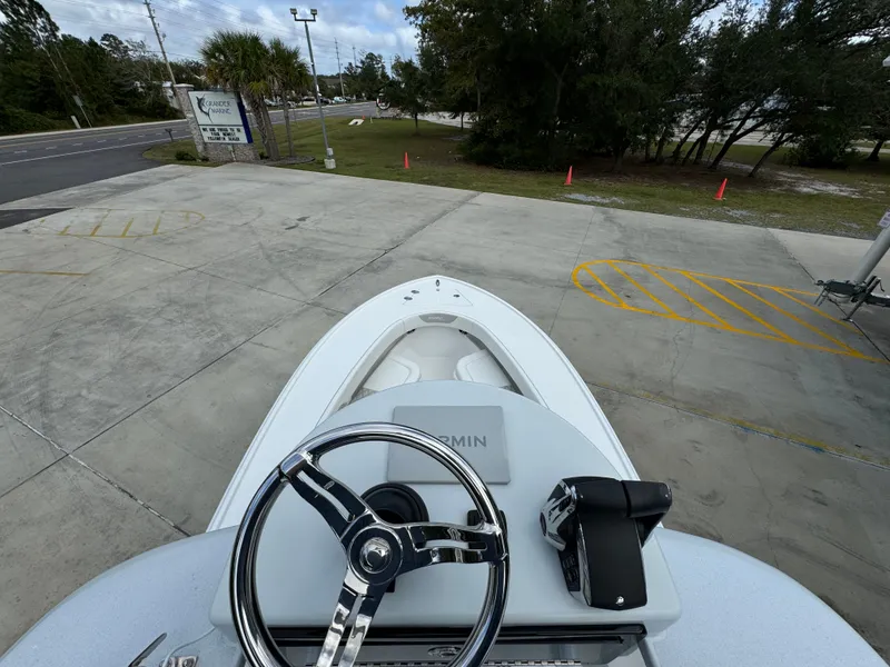 Slide: The Image of 2024 Front Runner 26 Center Console boat, top view of steering wheel and deck. - 39