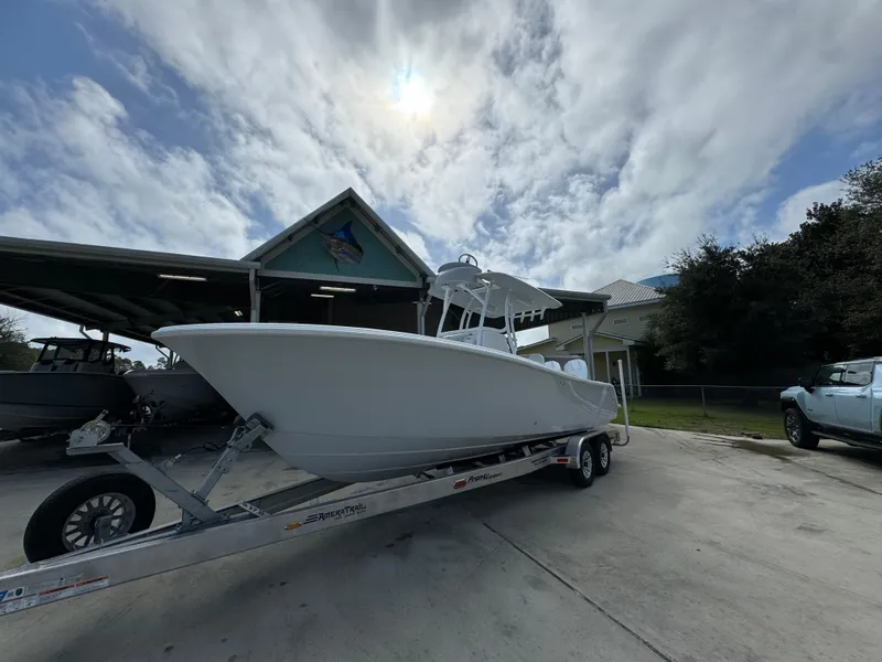 Slide: The Image of 2024 Front Runner 26 Center Console boat on trailer under cloudy sky. - 4