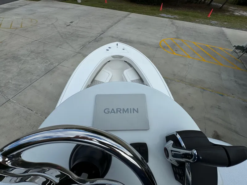 Slide: The Image of 2024 Front Runner 26 Center Console boat with Garmin navigation system, viewed from helm. - 40
