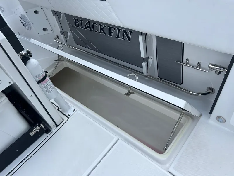 Slide: The Image of 2023 Blackfin 272 CC boat storage compartment with open hatch. - 13