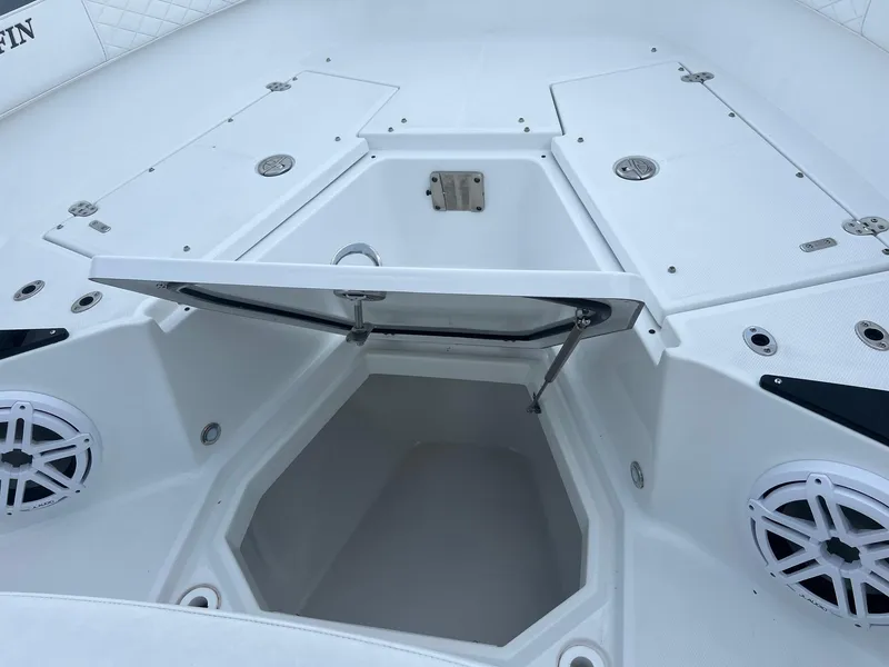 Slide: The Image of 2023 Blackfin 272 CC boat storage compartment with open hatch and speakers. - 20