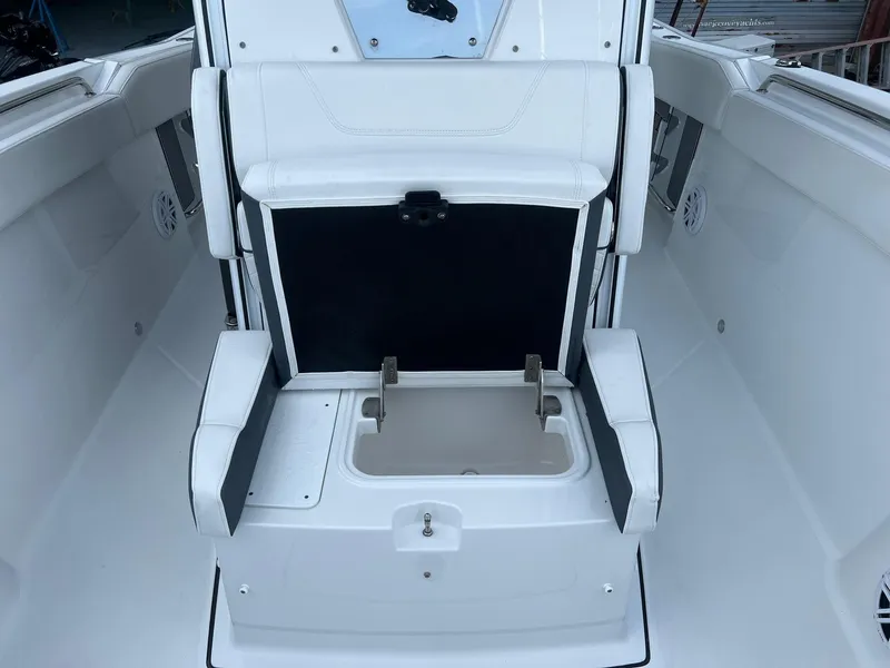 Slide: The Image of 2023 Blackfin 272 CC boat interior with seating and storage compartment. - 21
