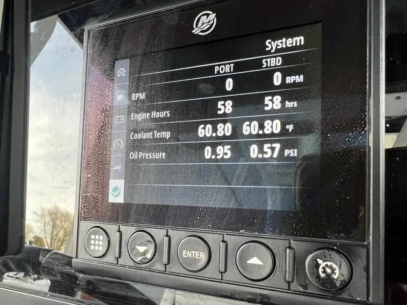 Slide: The Image of Display screen of 2023 Blackfin 272 CC showing engine stats and system information. - 4