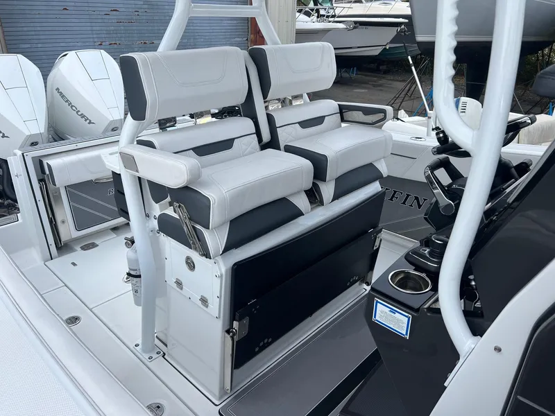 Slide: The Image of 2023 Blackfin 272 CC boat interior with dual seating and modern console. - 8