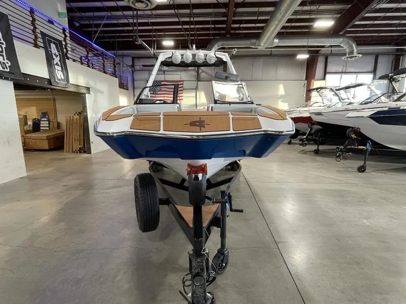 Slide: The Image of 2025 Axis A225 boat in showroom, front view on trailer. - 4