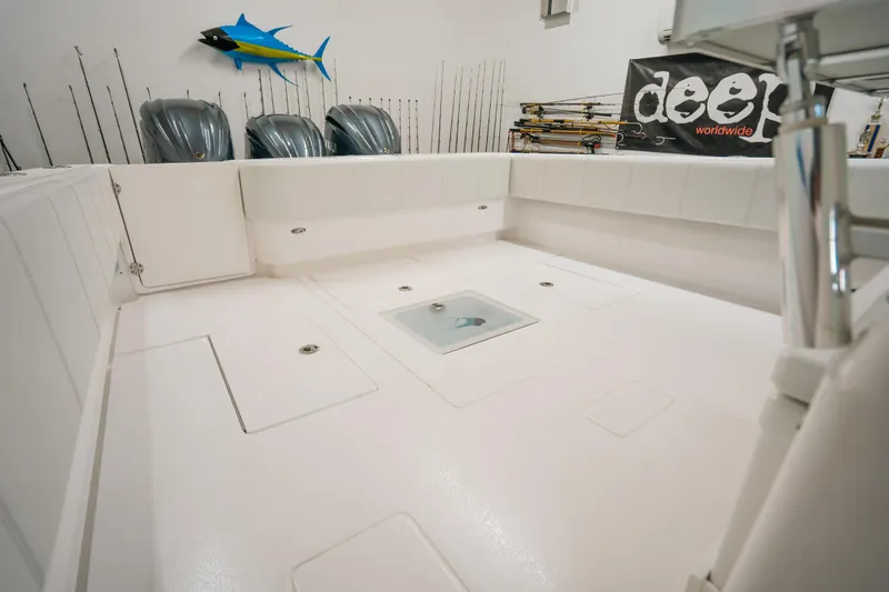 Slide: The Image of 2023 Contender 39 ST boat interior with fishing gear and storage compartments. - 12