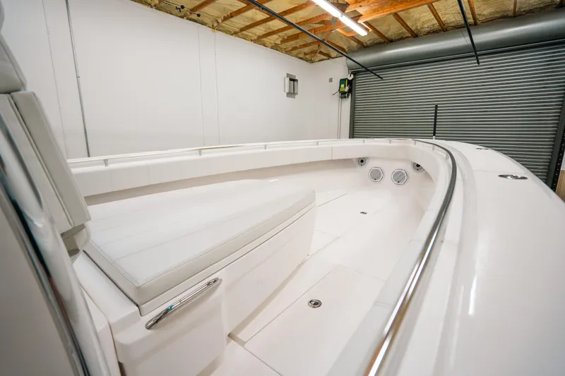 Slide: The Image of 2023 Contender 39 ST boat interior in a garage setting. - 24