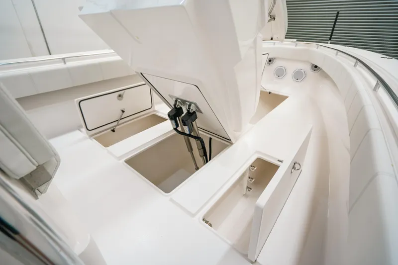 Slide: The Image of 2023 Contender 39 ST boat interior with open storage compartments. - 32