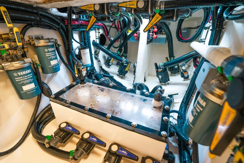 Slide: The Image of Engine room of 2023 Contender 39 ST boat with Yamaha filters and complex wiring. - 37