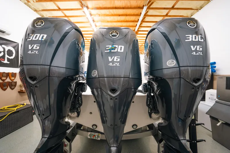 Slide: The Image of Triple Yamaha 300 V6 outboard engines on a 2023 Contender 39 ST boat. - 4