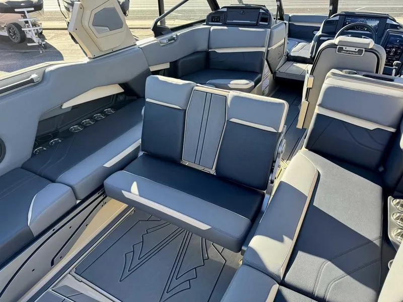 Slide: The Image of 2025 Supra SE boat interior with modern seating and sleek design. - 14