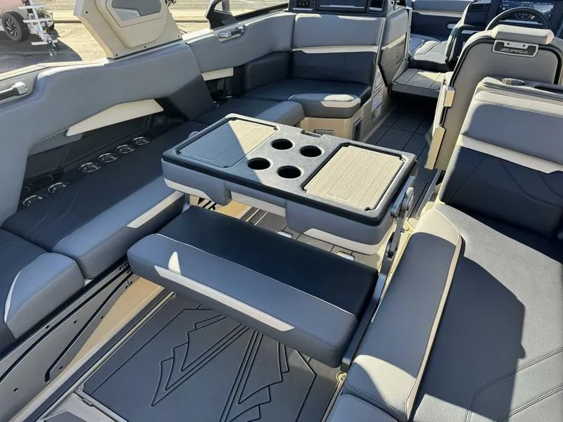 Slide: The Image of 2025 Supra SE boat interior with luxurious seating and cup holders. - 16